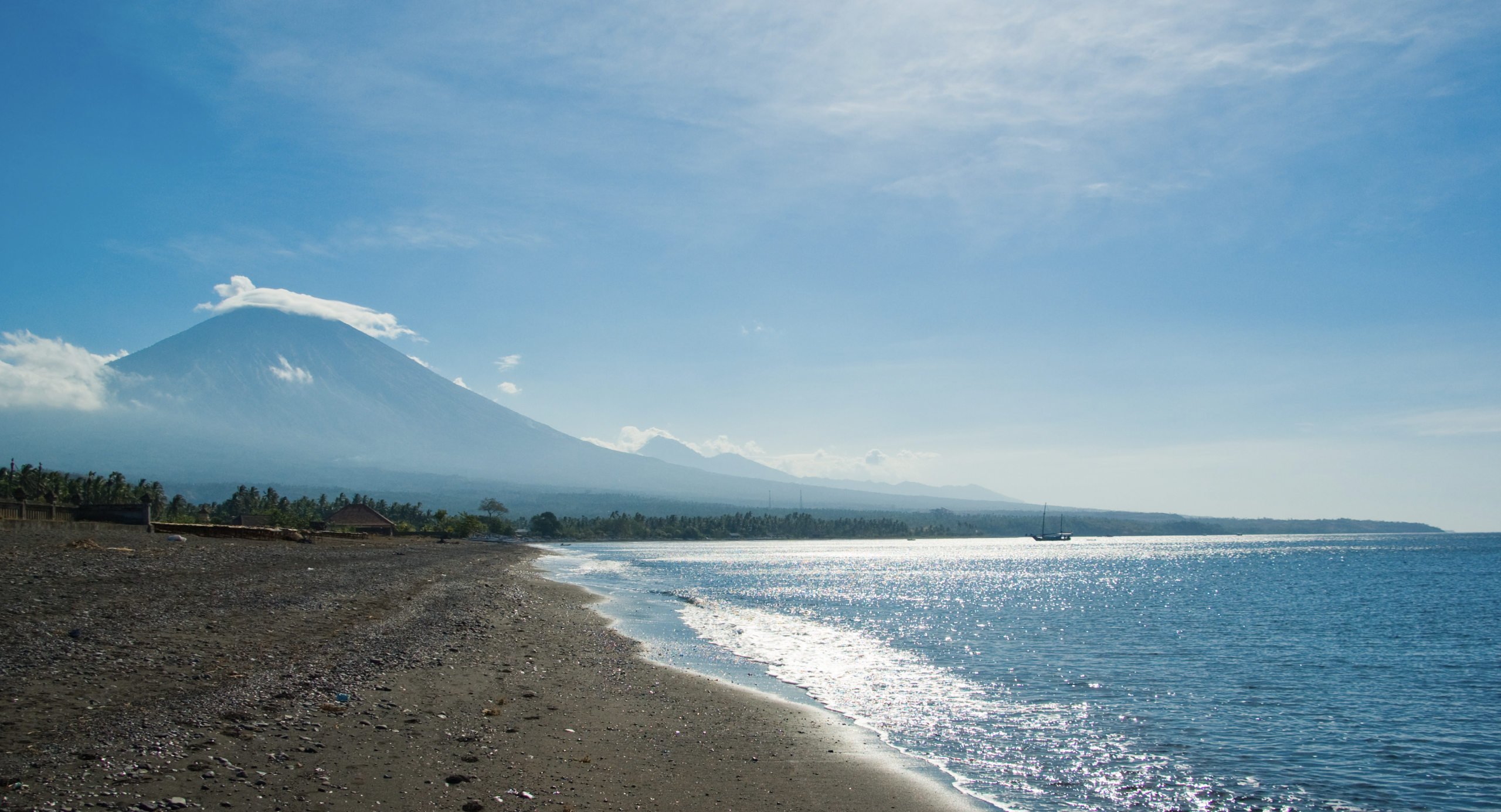 Amed fishing boats and volcanic coastline Bali